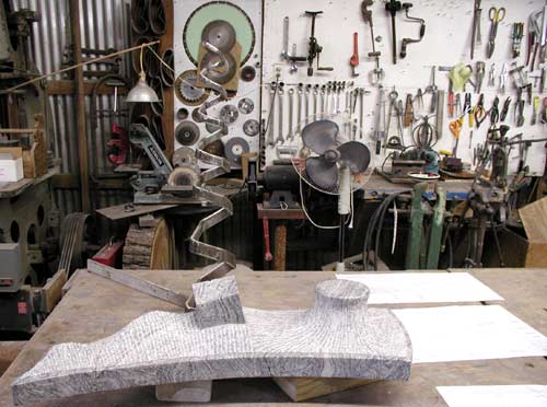 Sculpture against an array of tools