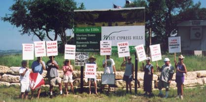 Picketing group against development sign 7/25/04.