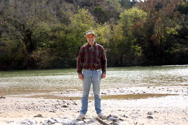 Grandpa standing by river
